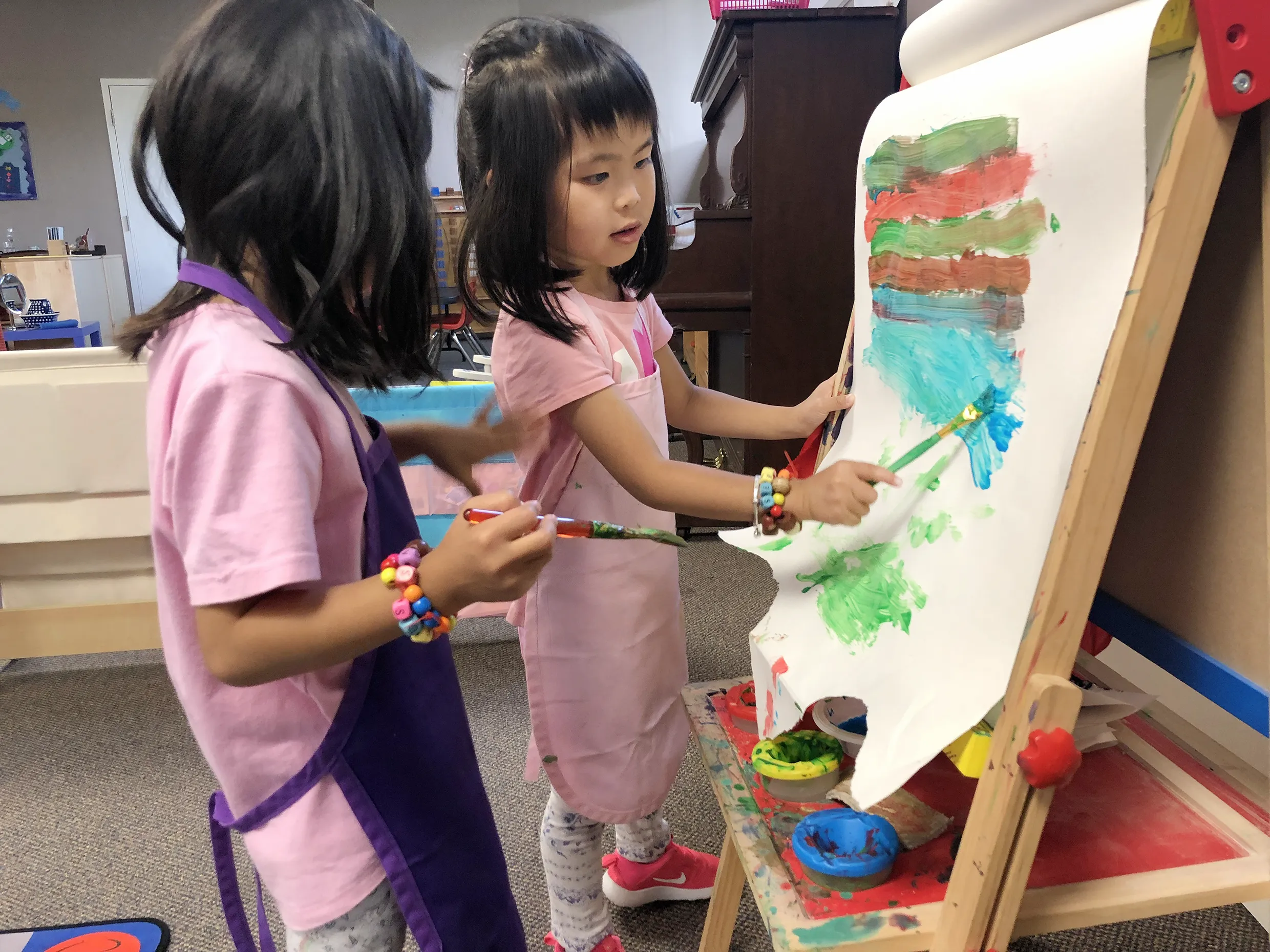 Child exploring a Montessori activity with bowls